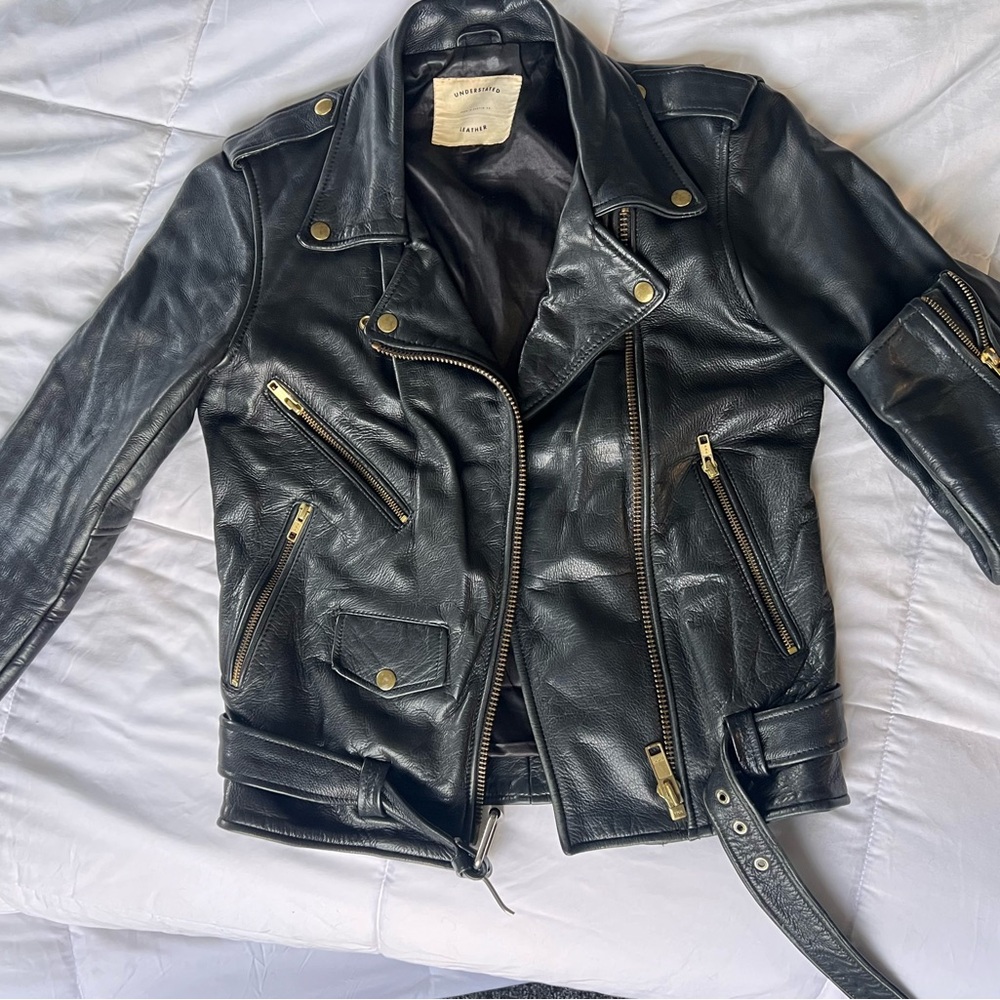 Understated Black Leather Jacket with Gold Details
